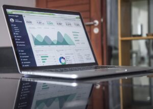 Analytics dashboard on a laptop screen, illustrating CSP licensing and partner margin posts
